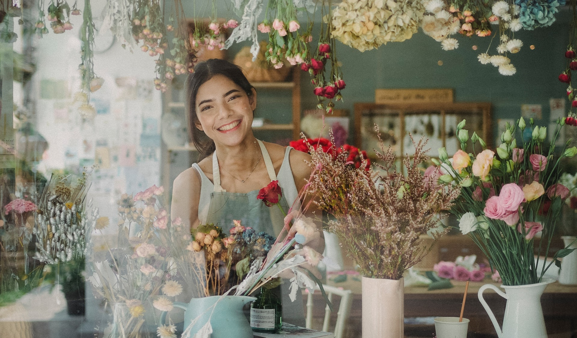 Couple sitting together on couch looking at laptop